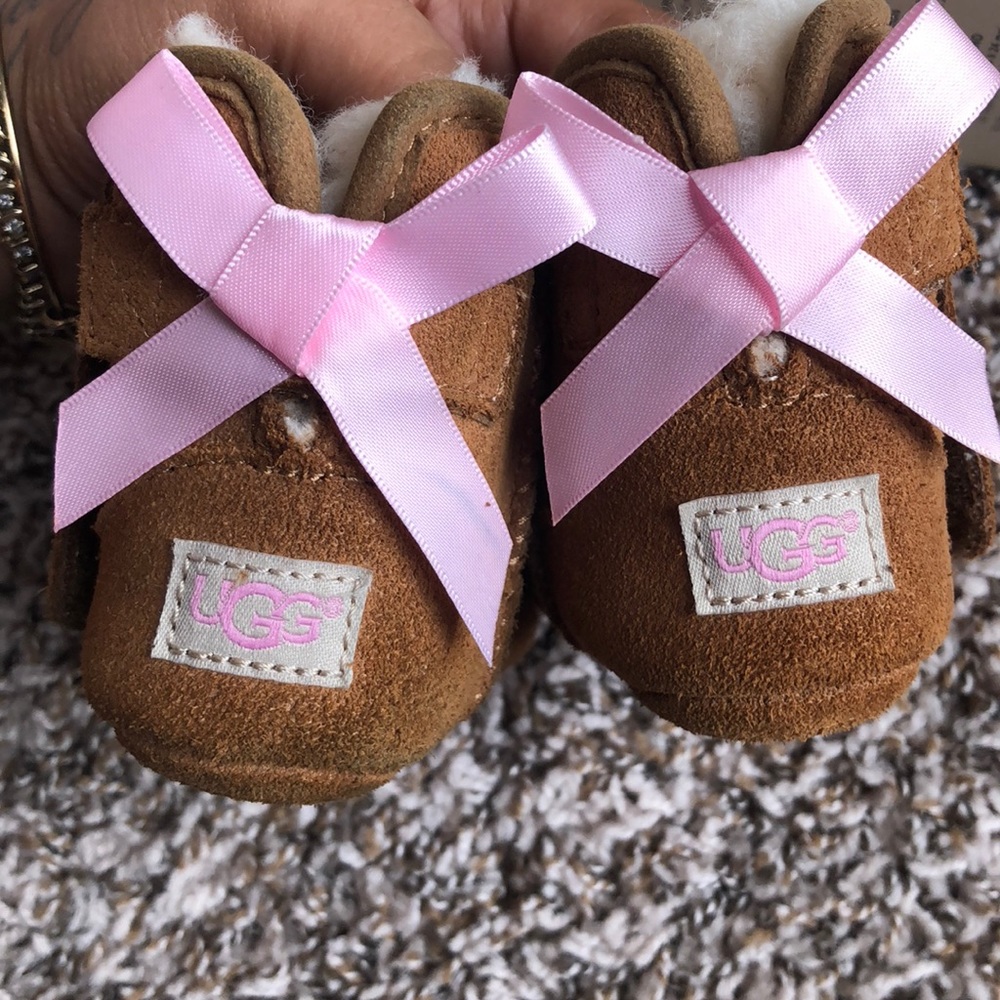Tan Bailey Bow UGGs with pink bow